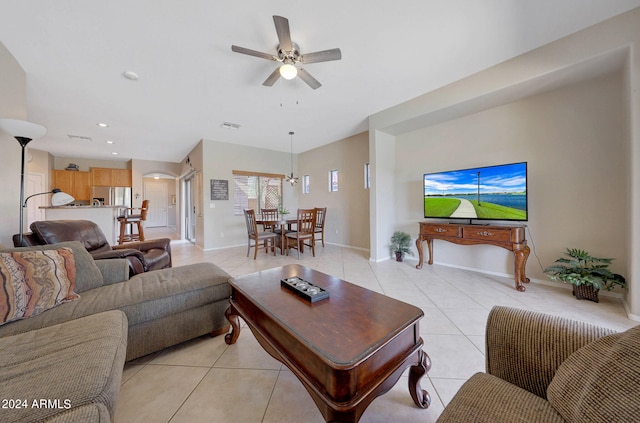 tiled living room featuring ceiling fan