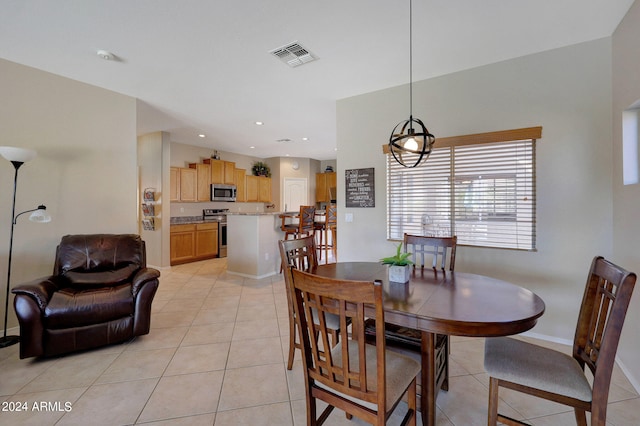 dining space featuring light tile patterned floors