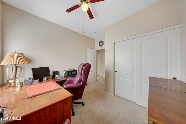 carpeted home office with ceiling fan