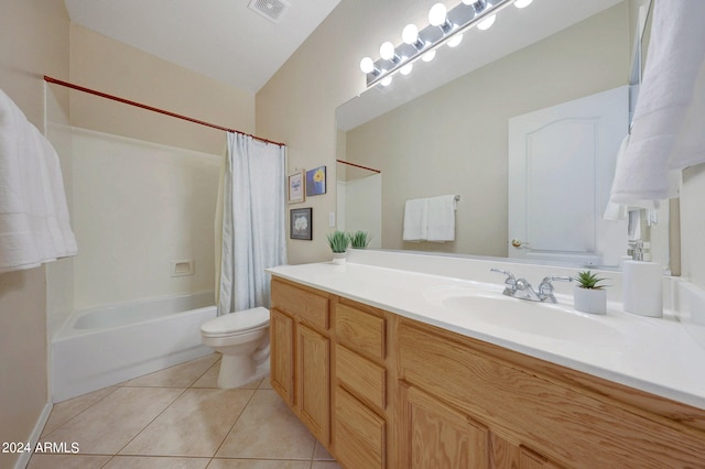 full bathroom featuring vaulted ceiling, vanity, tile patterned flooring, shower / tub combo with curtain, and toilet