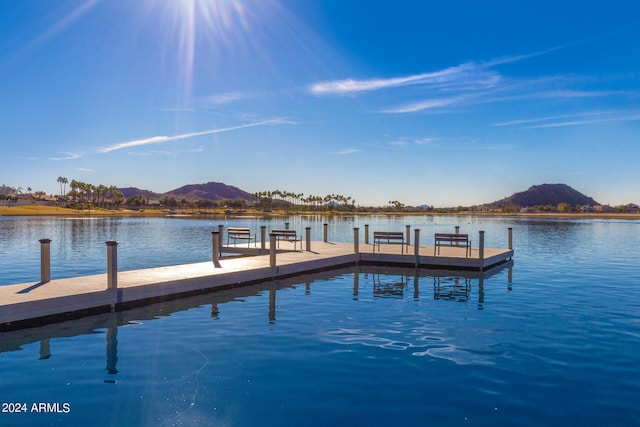 dock area featuring a water and mountain view