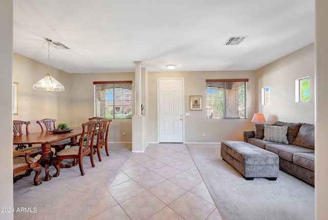 tiled living room with a healthy amount of sunlight