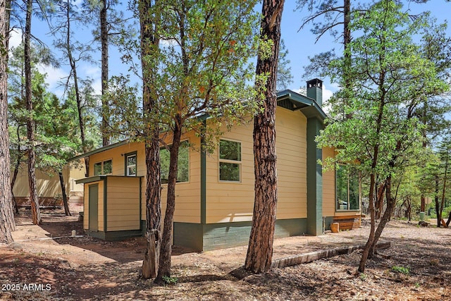 3674 N Navajo Dr, Pine, AZ 85544 - view of side of property featuring a chimney
