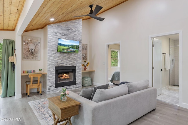 3674 N Navajo Dr, Pine, AZ 85544 - living room featuring wooden ceiling, ceiling fan, a fireplace, wood finished floors, and baseboards