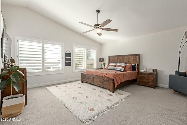 bedroom featuring carpet, baseboards, and vaulted ceiling