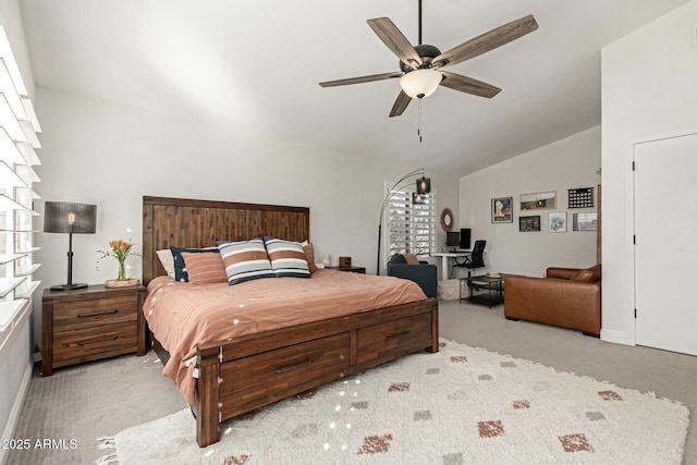 bedroom featuring ceiling fan, light carpet, vaulted ceiling, and multiple windows