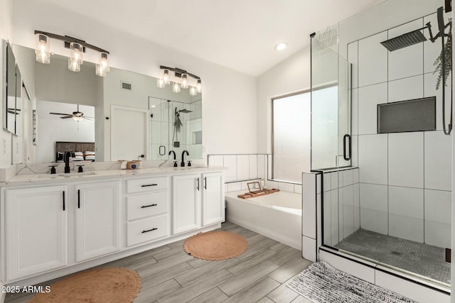 full bathroom featuring a sink, a stall shower, a garden tub, and visible vents