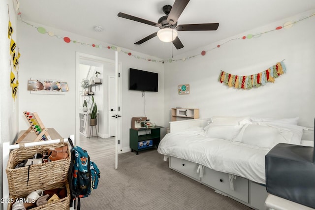 carpeted bedroom featuring a ceiling fan