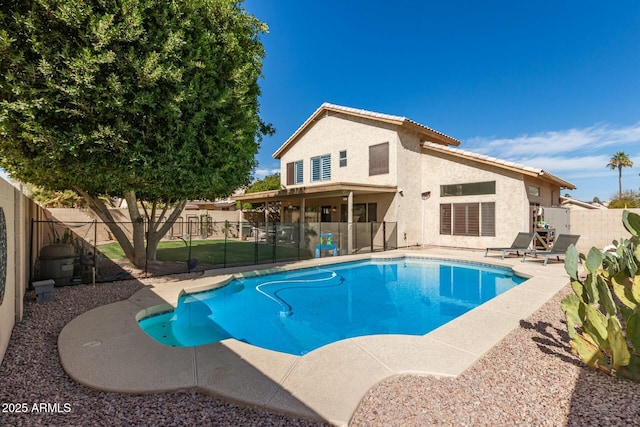 view of swimming pool featuring a patio area, a fenced backyard, and a fenced in pool