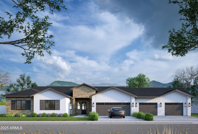 view of front of house featuring a garage and a mountain view