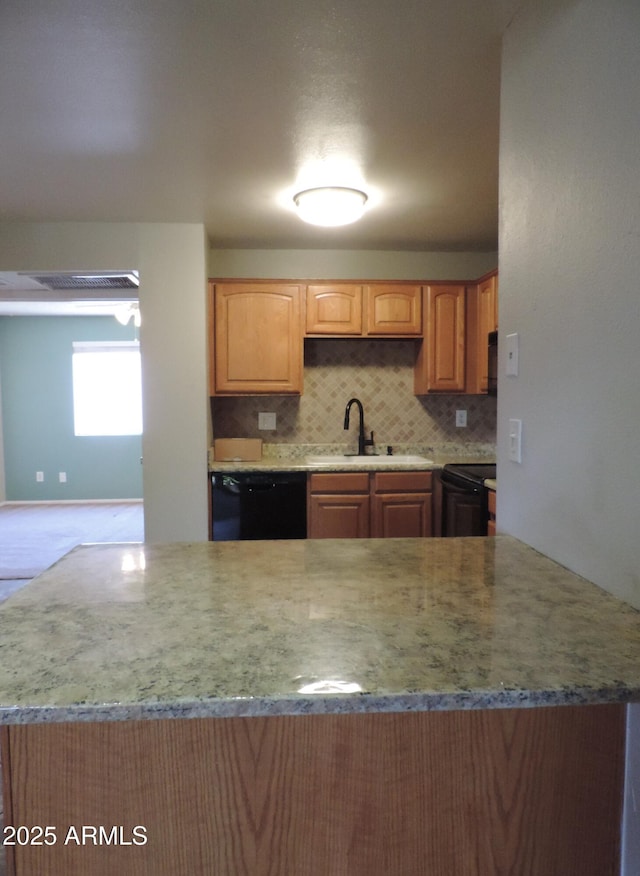 30 E Brown Rd Unit 2113, Mesa, AZ 85201 - kitchen featuring black appliances, decorative backsplash, and light stone counters