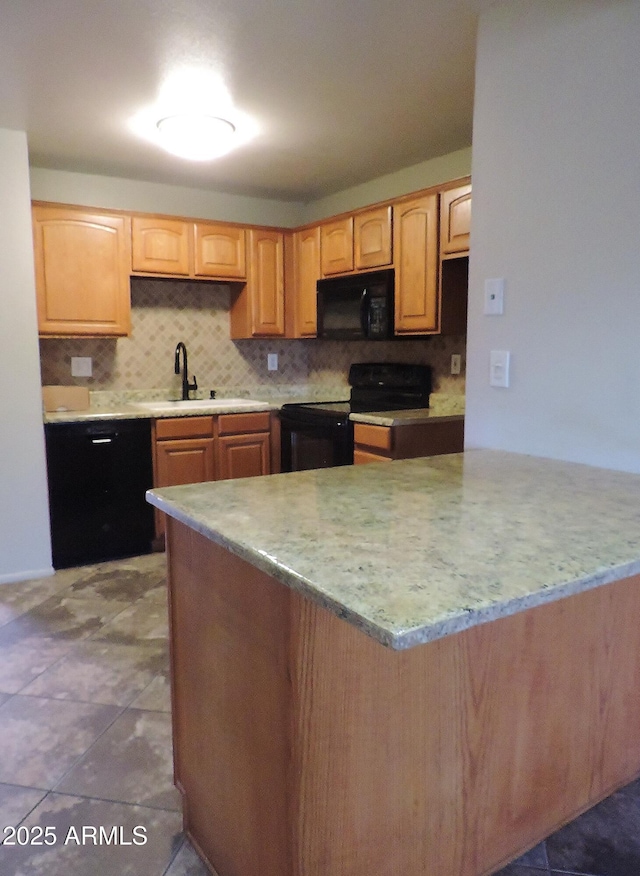 30 E Brown Rd Unit 2113, Mesa, AZ 85201 - kitchen featuring black appliances, backsplash, and a center island