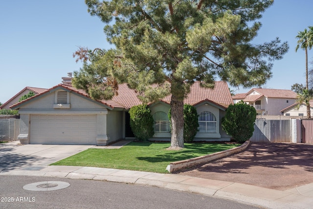 view of front of house featuring a tiled roof, a front yard, stucco siding, a garage, and driveway