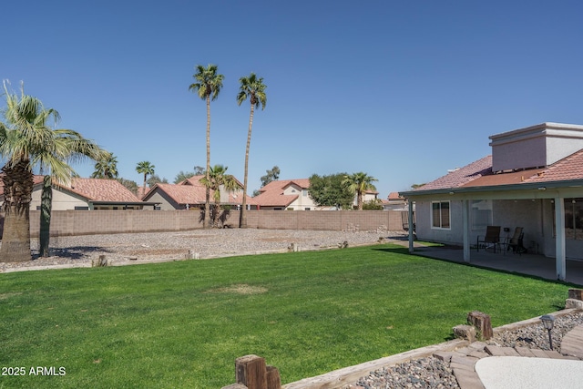 view of yard featuring a patio area and a fenced backyard