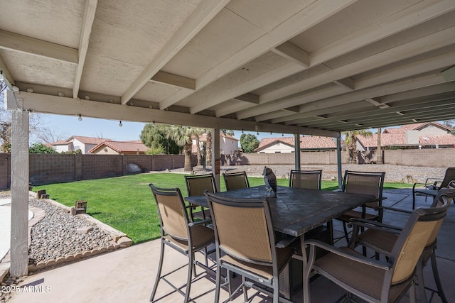 view of patio with outdoor dining space and a fenced backyard