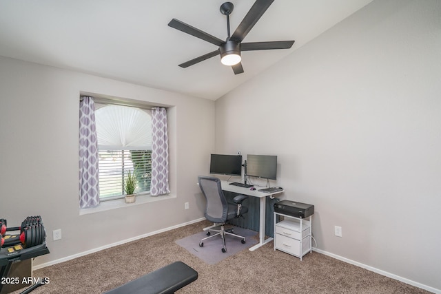 home office with carpet floors, a ceiling fan, baseboards, and vaulted ceiling