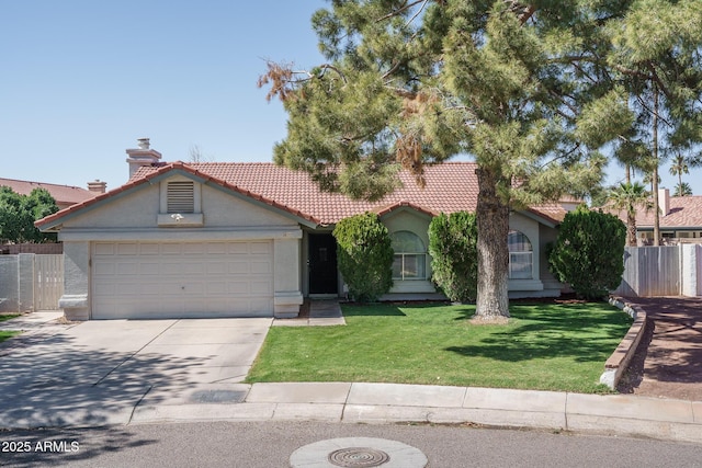 view of front of property with stucco siding, a tiled roof, a front yard, and fence