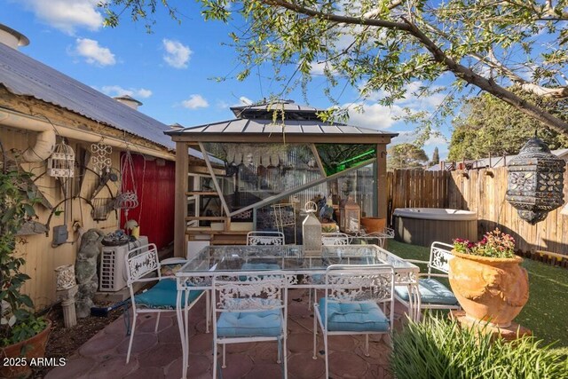 14 Black Knob Vw, Bisbee, AZ 85603 - view of patio with a gazebo, a hot tub, fence, and outdoor dining area
