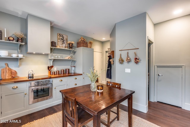 2402 E 5th St Unit 1742, Tempe, AZ 85288 - kitchen featuring white cabinetry, dark wood-type flooring, stainless steel oven, and wooden counters