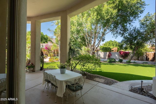 view of patio / terrace with outdoor dining area and a fenced backyard