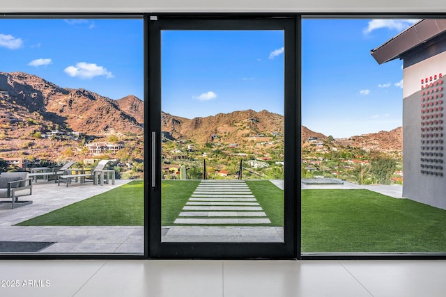 doorway featuring a mountain view and a wealth of natural light