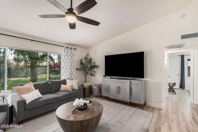 9265 E Kalil Dr, Scottsdale, AZ 85260 - living room featuring lofted ceiling, light wood-style floors, a ceiling fan, and baseboards