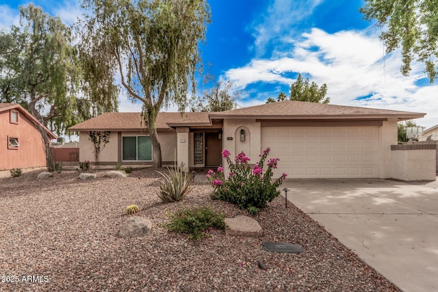 9265 E Kalil Dr, Scottsdale, AZ 85260 - single story home featuring stucco siding, a garage, and concrete driveway
