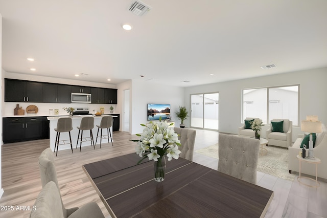 dining room with light hardwood / wood-style floors