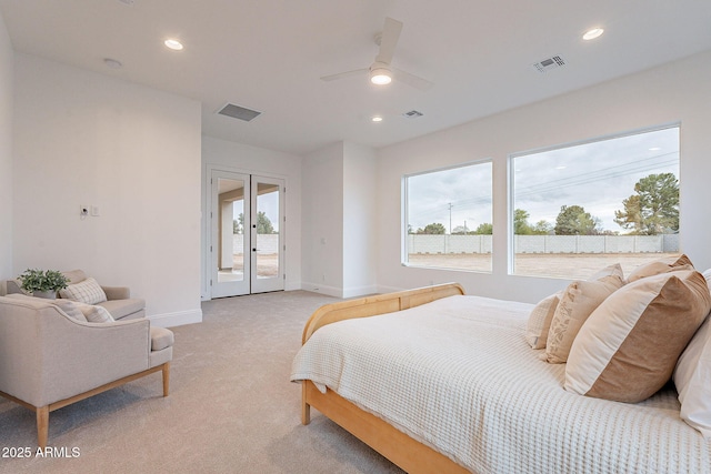 bedroom with visible vents, light colored carpet, recessed lighting, french doors, and access to outside