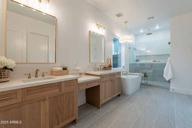 bathroom featuring visible vents, a soaking tub, a stall shower, and vanity