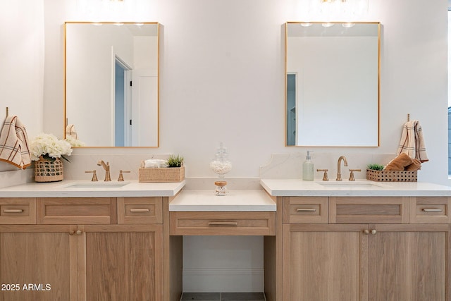 full bath featuring a sink, decorative backsplash, and two vanities