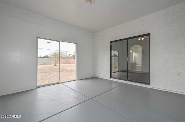 empty room featuring concrete floors