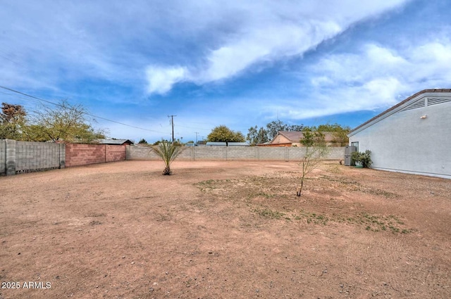 view of yard with a fenced backyard