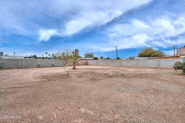 view of yard featuring fence