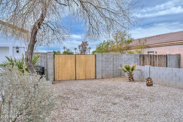 view of yard featuring a gate and fence