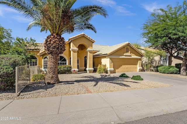 16002 E Gleneagle Dr, Fountain Hills, AZ 85268 - mediterranean / spanish home featuring stucco siding, driveway, an attached garage, and a tiled roof
