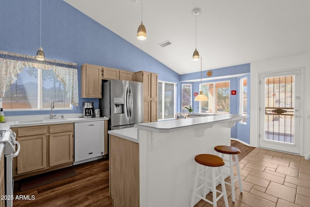 16002 E Gleneagle Dr, Fountain Hills, AZ 85268 - kitchen with appliances with stainless steel finishes, a sink, lofted ceiling, a center island with sink, and light countertops