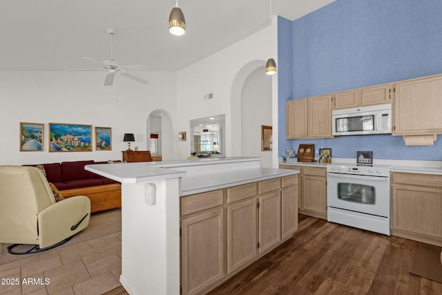 16002 E Gleneagle Dr, Fountain Hills, AZ 85268 - kitchen with white appliances, arched walkways, light brown cabinets, open floor plan, and high vaulted ceiling