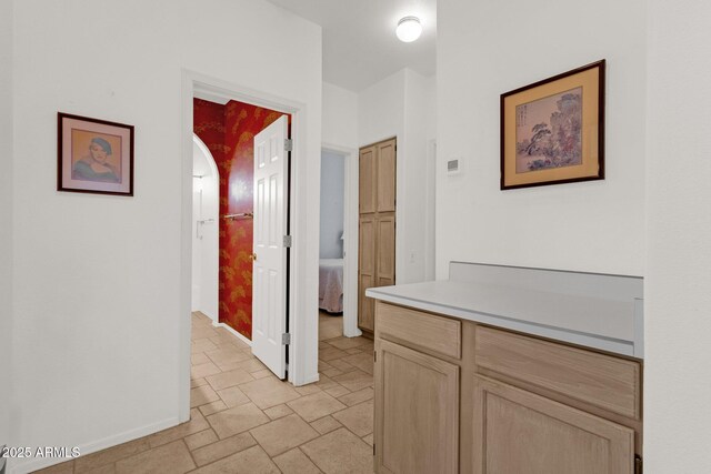 16002 E Gleneagle Dr, Fountain Hills, AZ 85268 - corridor featuring light stone finish floors and baseboards