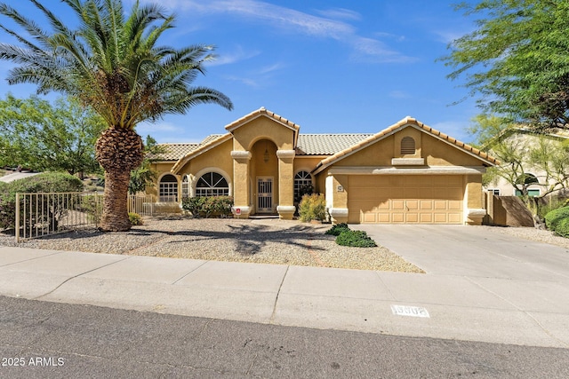 16002 E Gleneagle Dr, Fountain Hills, AZ 85268 - mediterranean / spanish-style house featuring an attached garage, stucco siding, driveway, and a tiled roof