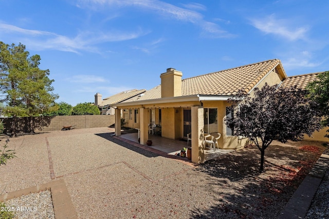 16002 E Gleneagle Dr, Fountain Hills, AZ 85268 - rear view of house with stucco siding, a tiled roof, a fenced backyard, a chimney, and a patio