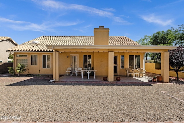16002 E Gleneagle Dr, Fountain Hills, AZ 85268 - rear view of property featuring a chimney, a tiled roof, stucco siding, and a patio area