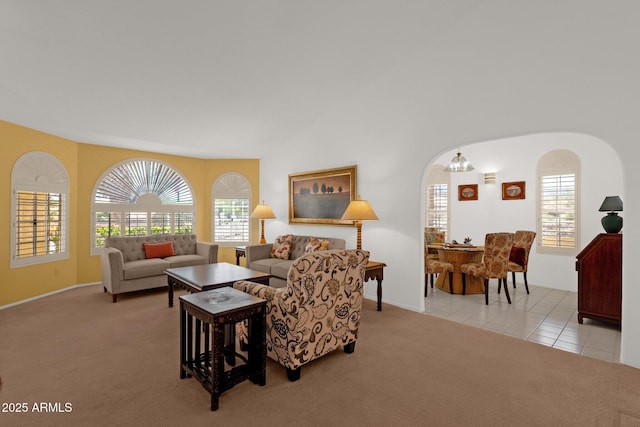 16002 E Gleneagle Dr, Fountain Hills, AZ 85268 - living area with light colored carpet, arched walkways, baseboards, and light tile patterned flooring