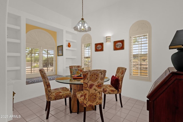 16002 E Gleneagle Dr, Fountain Hills, AZ 85268 - dining area with built in shelves, plenty of natural light, baseboards, and light tile patterned floors