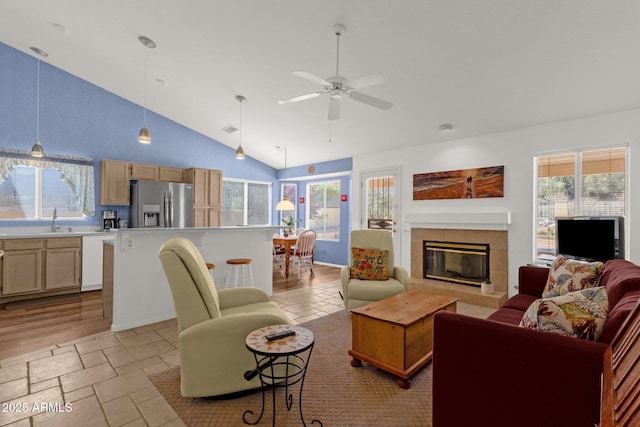 16002 E Gleneagle Dr, Fountain Hills, AZ 85268 - living area with a tile fireplace, high vaulted ceiling, ceiling fan, and plenty of natural light