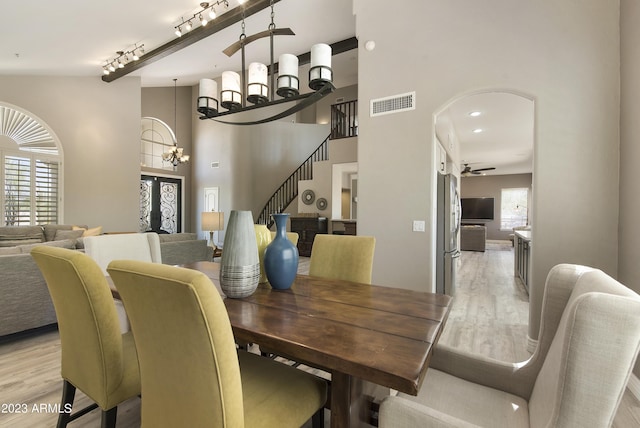29771 N 67th St, Scottsdale, AZ 85266 - dining space with a wealth of natural light, ceiling fan with notable chandelier, light wood-style floors, and visible vents