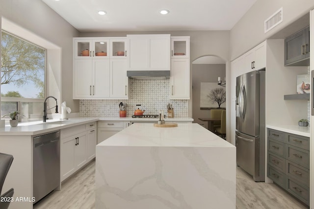 29771 N 67th St, Scottsdale, AZ 85266 - kitchen with white cabinetry, tasteful backsplash, appliances with stainless steel finishes, and visible vents
