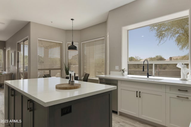 29771 N 67th St, Scottsdale, AZ 85266 - kitchen with dishwasher, light countertops, a sink, and hanging light fixtures