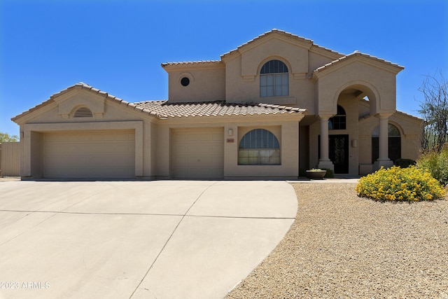 29771 N 67th St, Scottsdale, AZ 85266 - mediterranean / spanish home featuring a tile roof, concrete driveway, stucco siding, and a garage