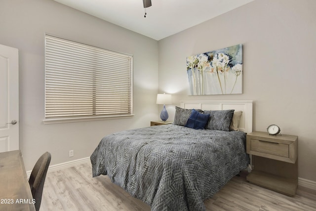 29771 N 67th St, Scottsdale, AZ 85266 - bedroom featuring baseboards, wood finished floors, and a ceiling fan